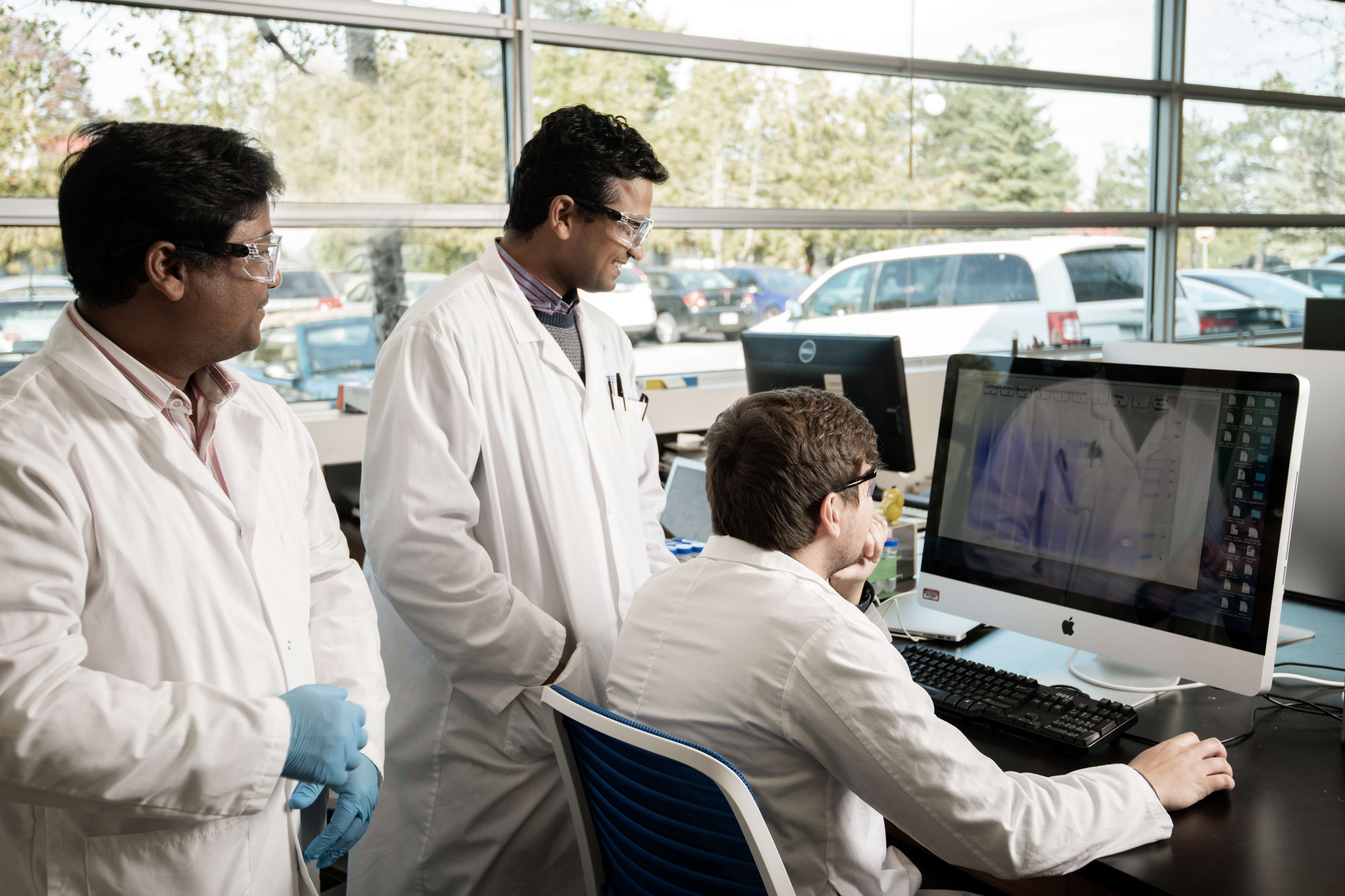 Noblegen scientists analyzing data on a computer in the lab